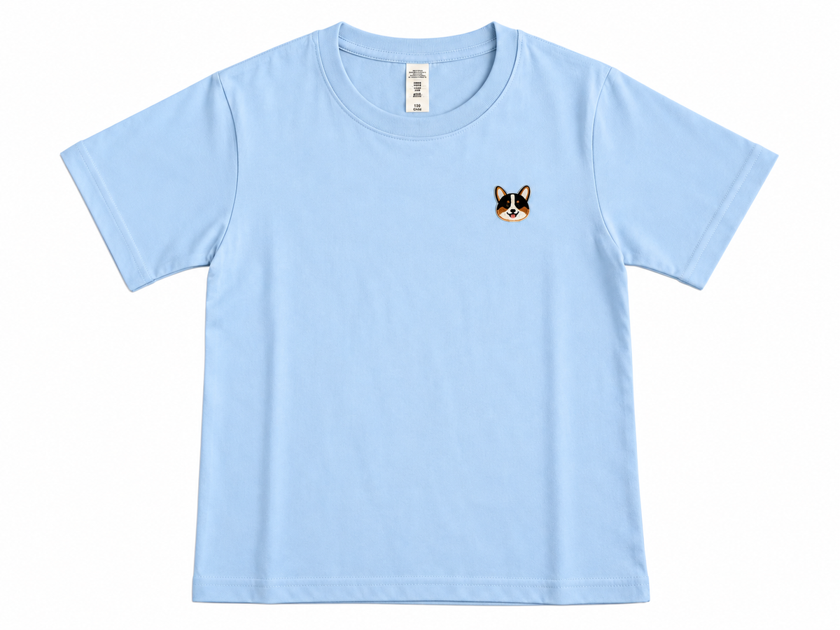 A light blue short-sleeve crewneck t-shirt with a small embroidered corgi dog face on the left chest, displayed flat against a white background.
