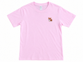 A light pink short-sleeve crewneck t-shirt featuring a small embroidered corgi dog graphic on the left chest, displayed flat against a white background.