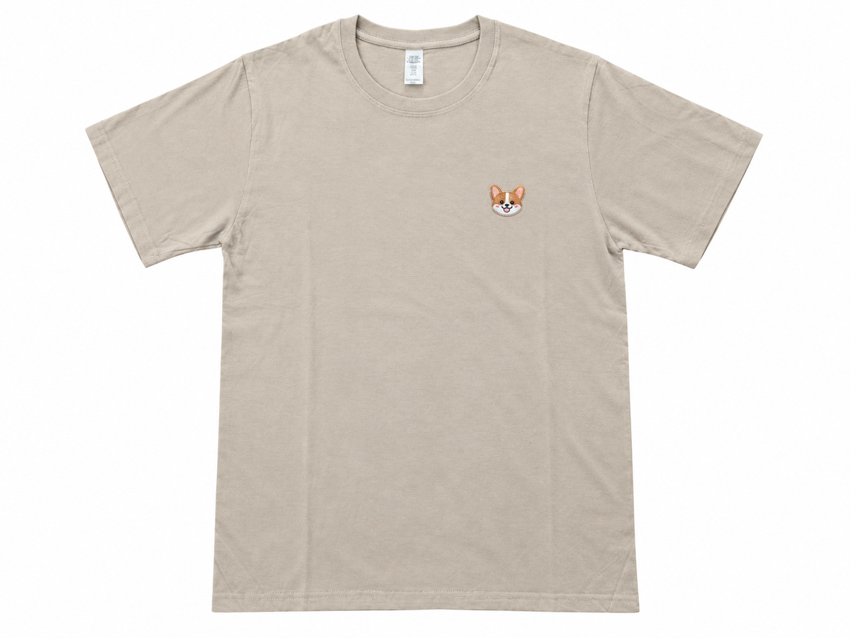 A light beige crewneck t-shirt with a small embroidered fox face on the left chest, displayed flat against a white background.