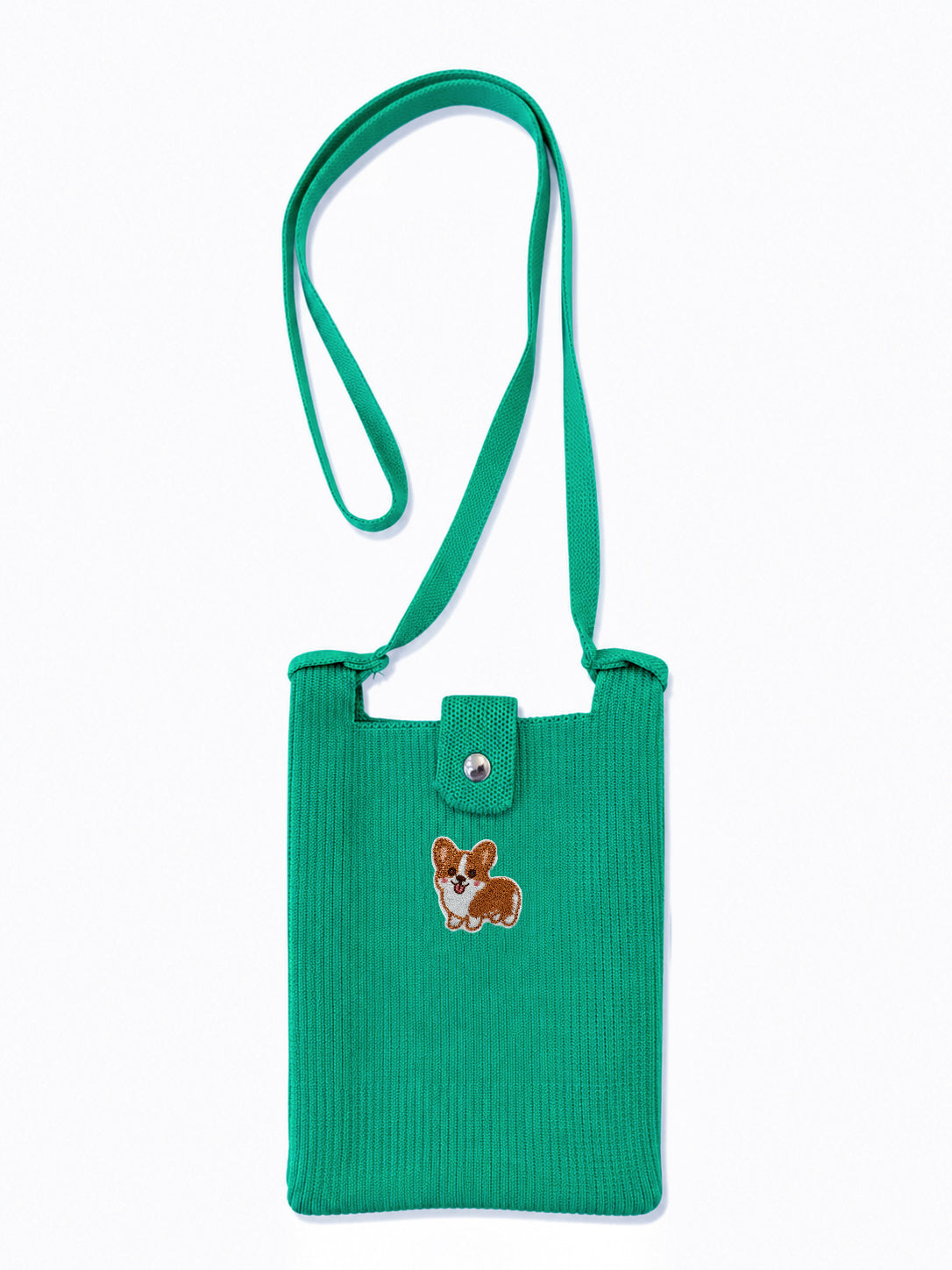 A green ribbed corduroy shoulder bag with a matching strap, featuring a small embroidered corgi on the front flap and a snap button closure