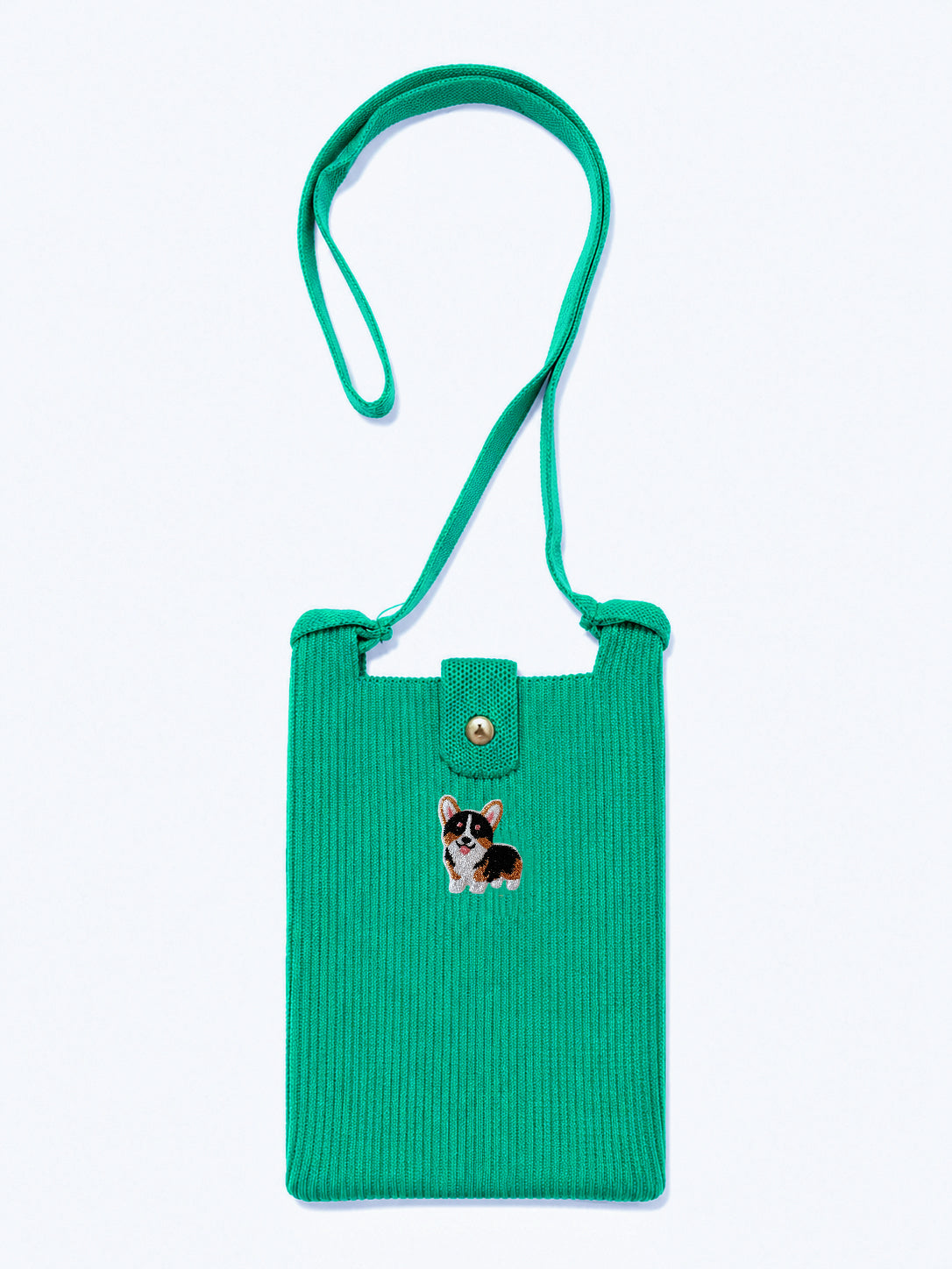 A bright green ribbed knit crossbody phone bag with a  strap, featuring a small embroidered corgi dog on the front and a snap button closure