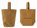Two views of a brown canvas tote bag with a handle, shown on a plain white background. The left view shows the front, and the right view shows the back with a folded front pocket.