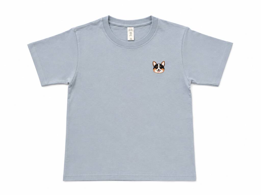 A misty blue short-sleeve crewneck t-shirt with a small embroidered corgi face on the left chest, displayed flat against a white background.