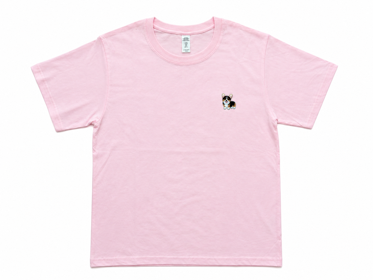 A light pink short-sleeve crewneck t-shirt with a small embroidered corgi on the left chest, displayed flat against a white background.